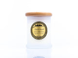 Medium 'Dark Musk' candle in a white container with a wooden lid. The gold label with black text reads 'Dark Musk, Soy Wax, Amber, Tonka Beans, Benzoin,' and features the Sifr Aromatics logo in black